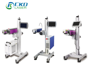Three CKD Laser flying marking machines — UV, fiber, and CO₂ models — displayed on adjustable aluminum frames with touchscreen controllers, positioned side-by-side for comparison.