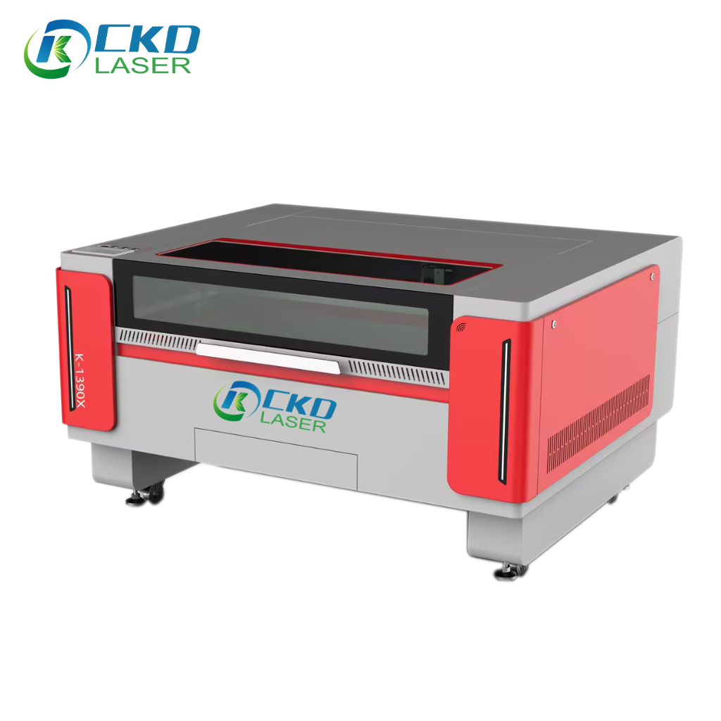 Image of a CKD LASER K-1390X $\text{CO}_2$ laser cutting machine, used for engraving and cutting non-metal materials. It is gray and red with a safety enclosure.